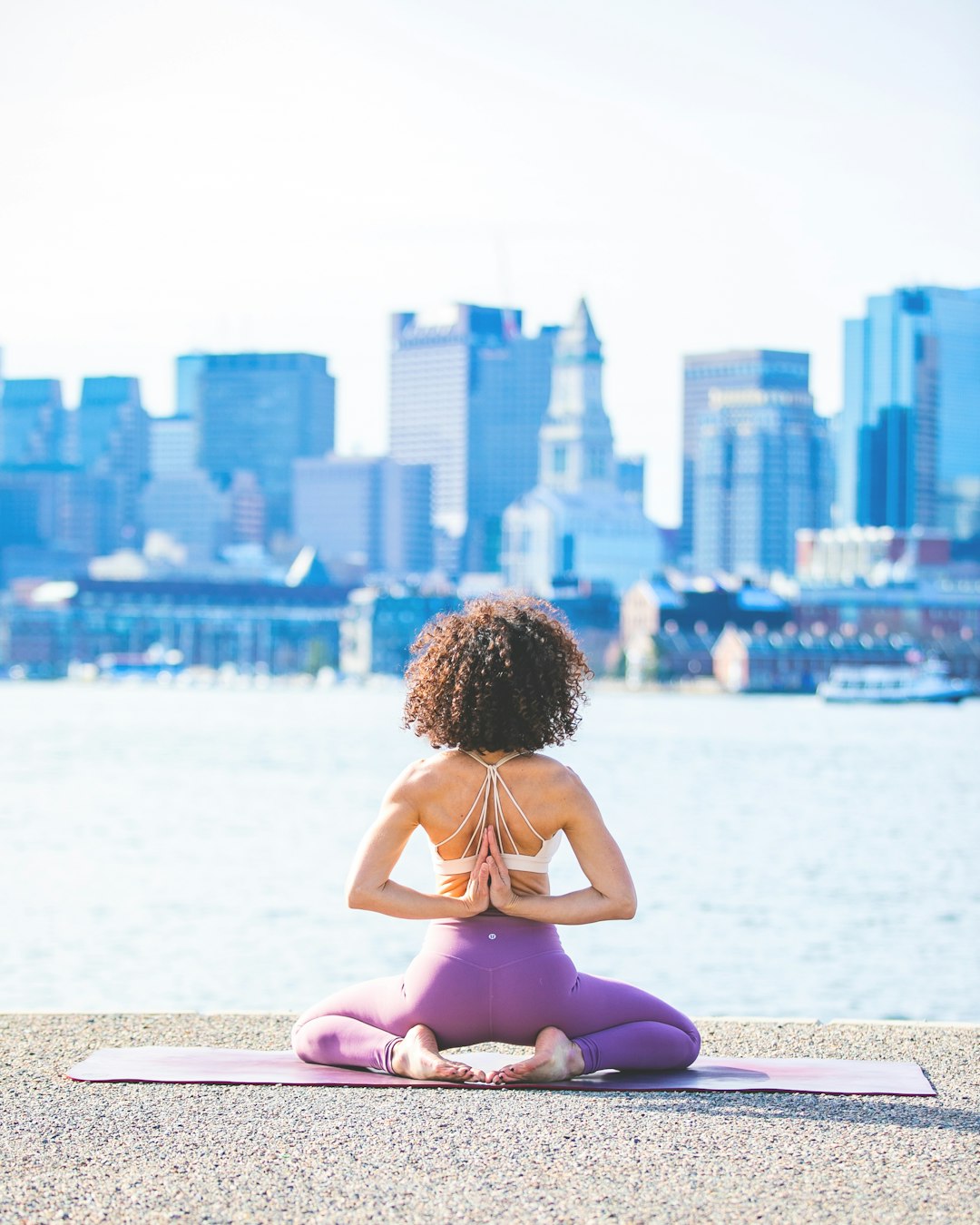 woman-doing-yoga-facing-calm-body-of-water-8eexlsq4adk